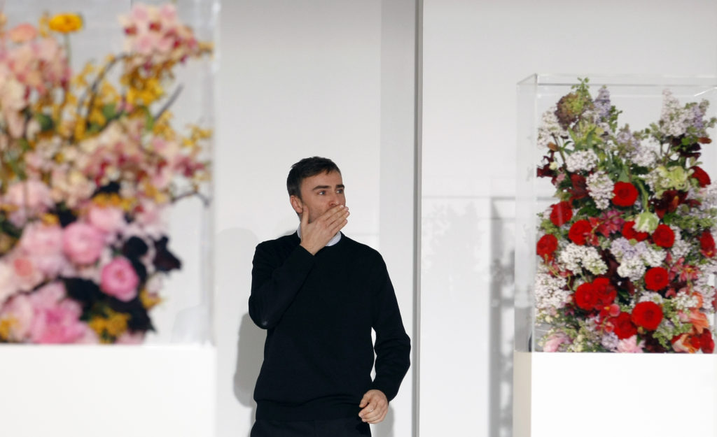 Belgian designer Raf Simons acknowledges the applause at the end of the Jil Sander 2012 Autumn/Winter collection during Milan Fashion Week February 25, 2012. REUTERS/Alessandro Garofalo (ITALY - Tags: FASHION)